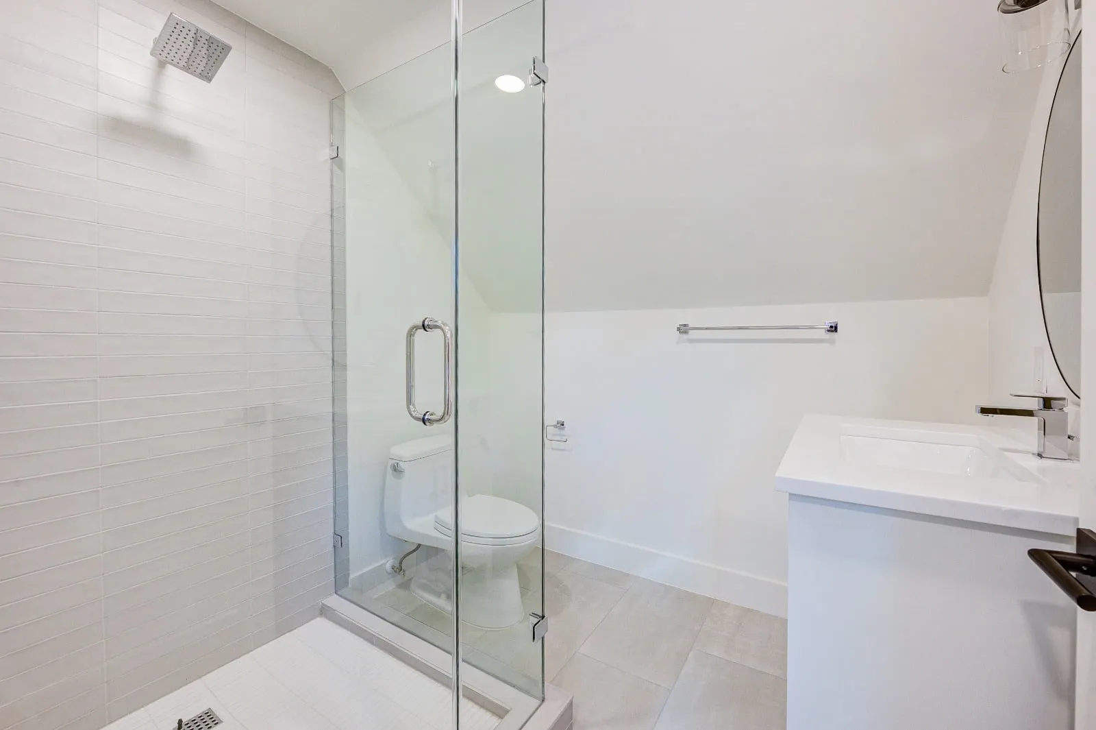 Marble bathroom with frameless glass and brushed nickel fittings in Carlton Woods, The Woodlands, TX