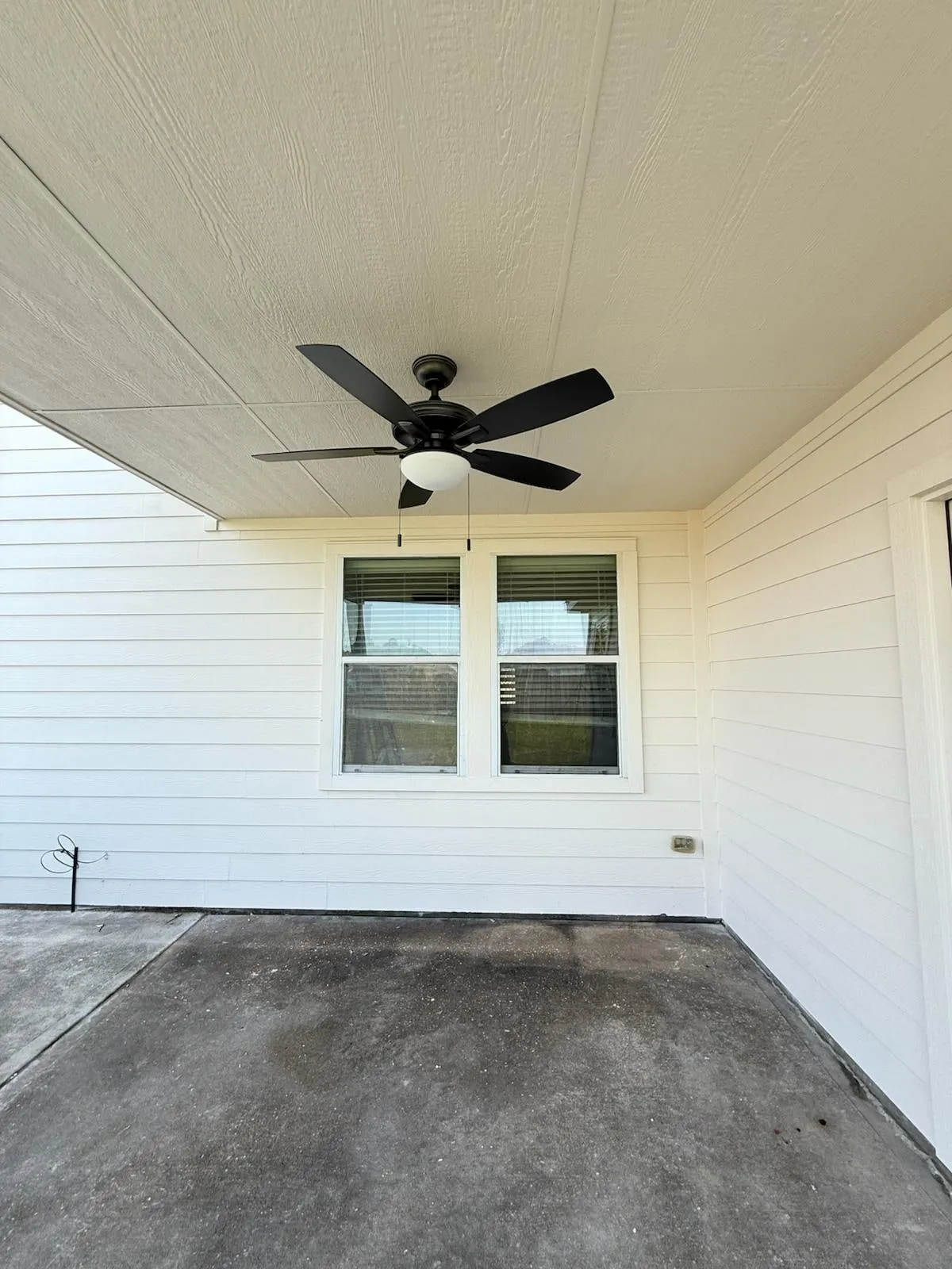 Home addition opening to the existing house through French doors in Creekside Park, The Woodlands, TX
