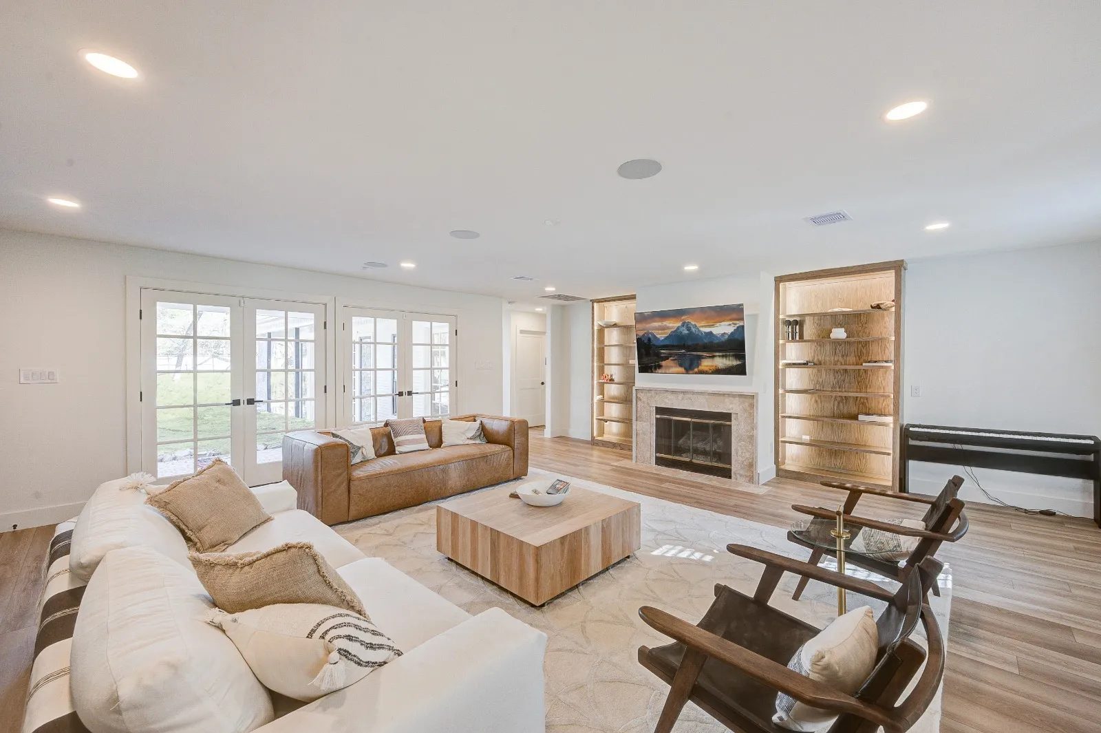 Living room with custom built-ins after a whole home renovation in The Woodlands, TX