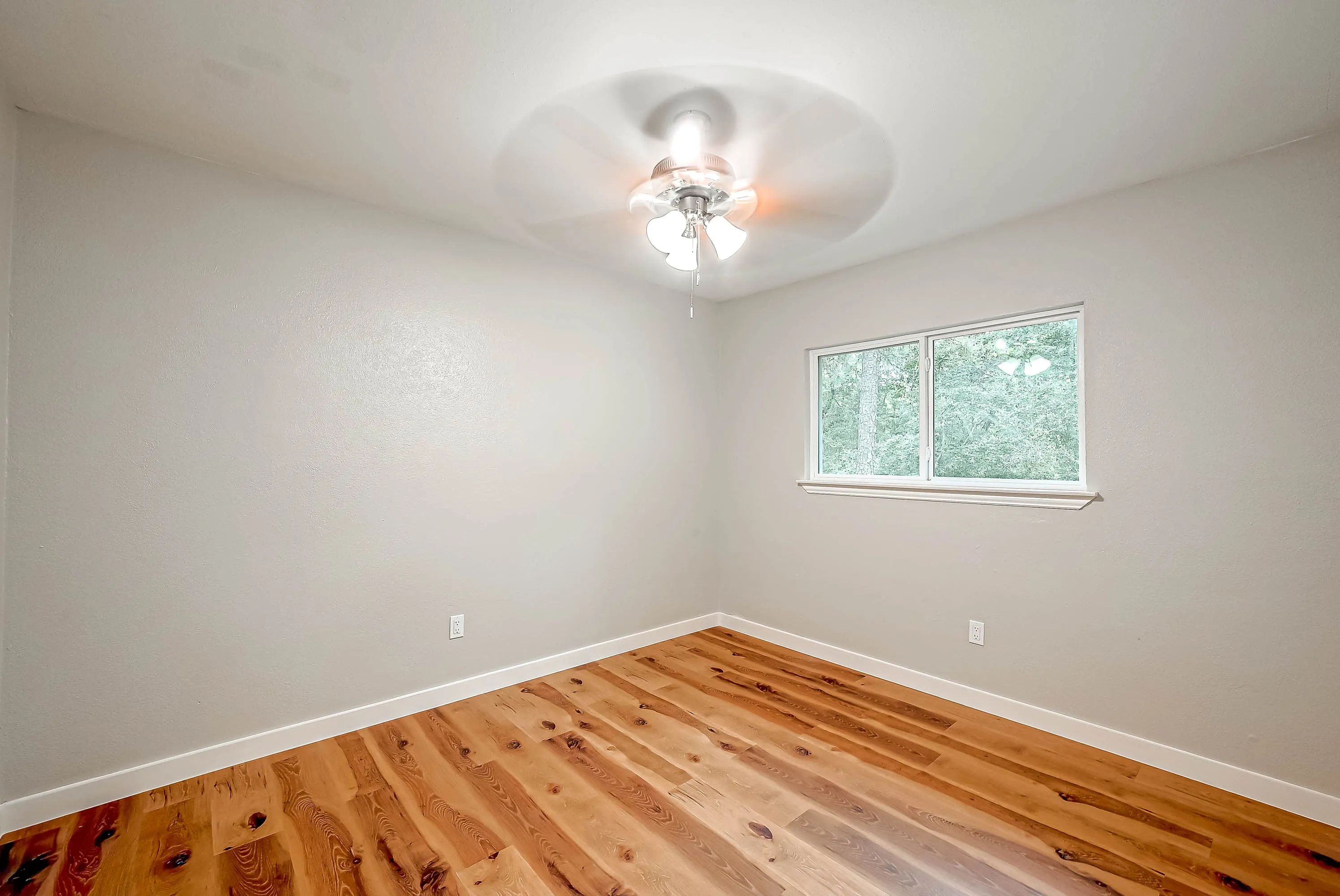 Whole home renovation of a mid-century house with a new kitchen and stair in The Woodlands, TX