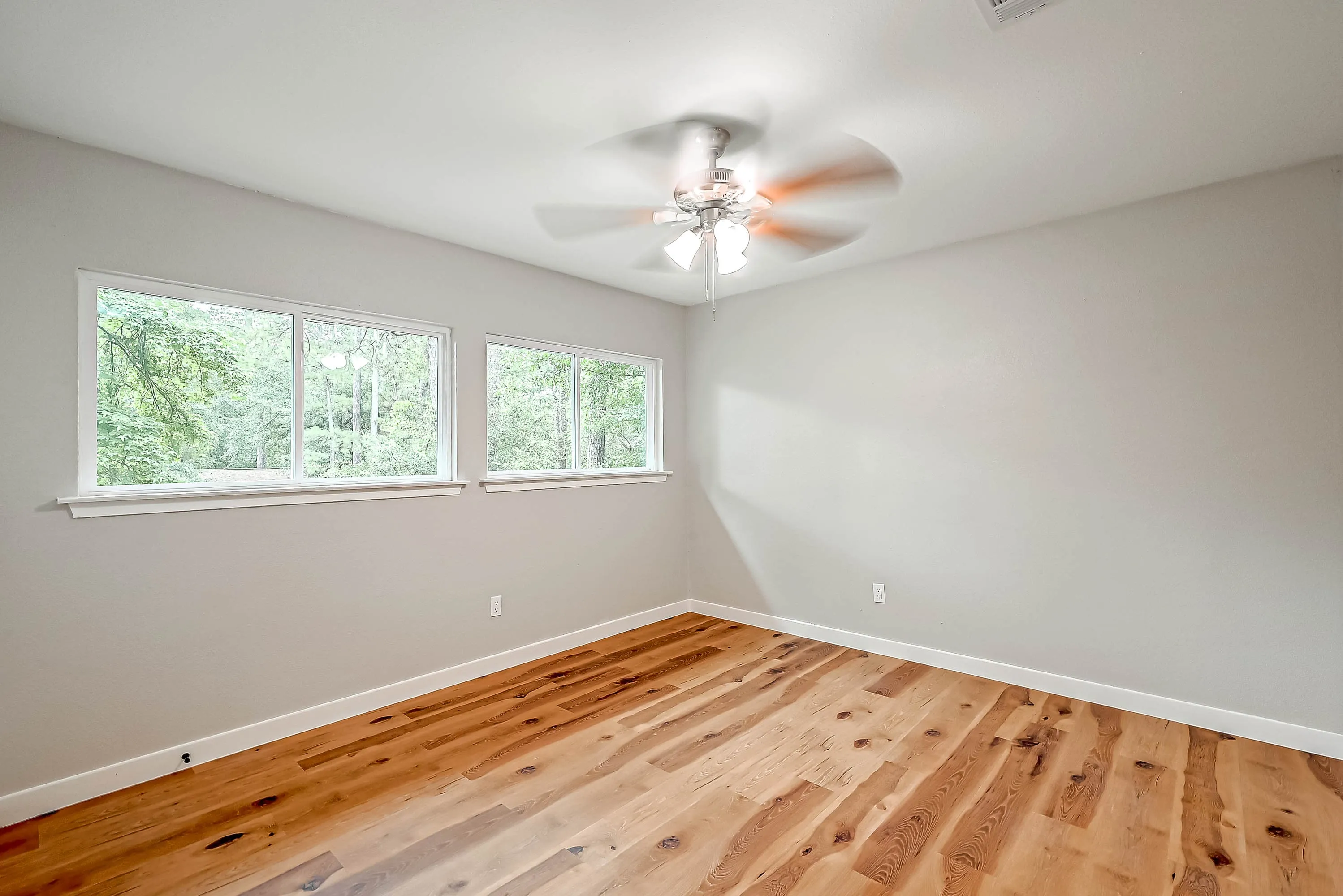 Whole home renovation of a mid-century house with a new kitchen and stair in The Woodlands, TX