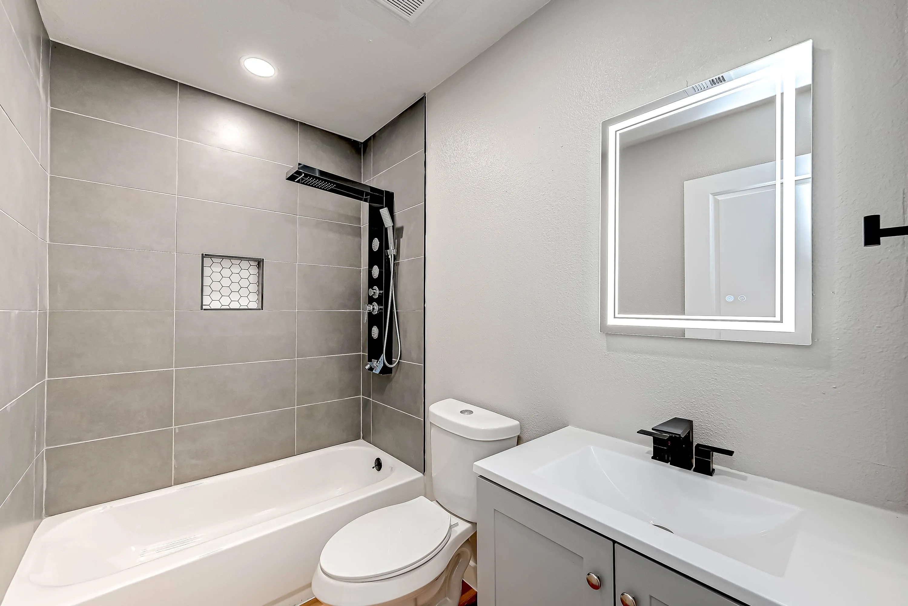 Whole home renovation of a mid-century house with a new kitchen and stair in The Woodlands, TX