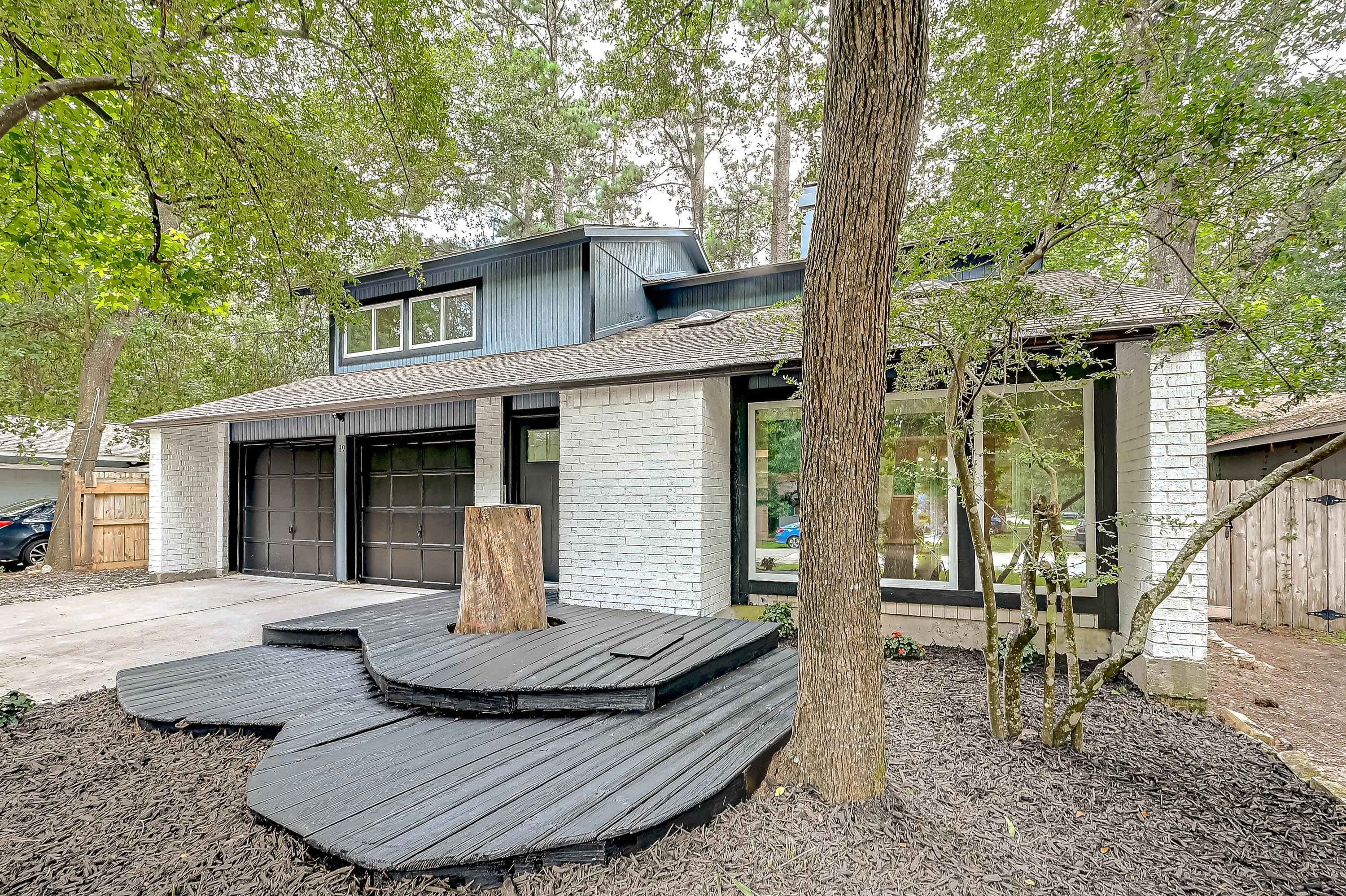 Whole home renovation of a mid-century house with a new kitchen and stair in The Woodlands, TX
