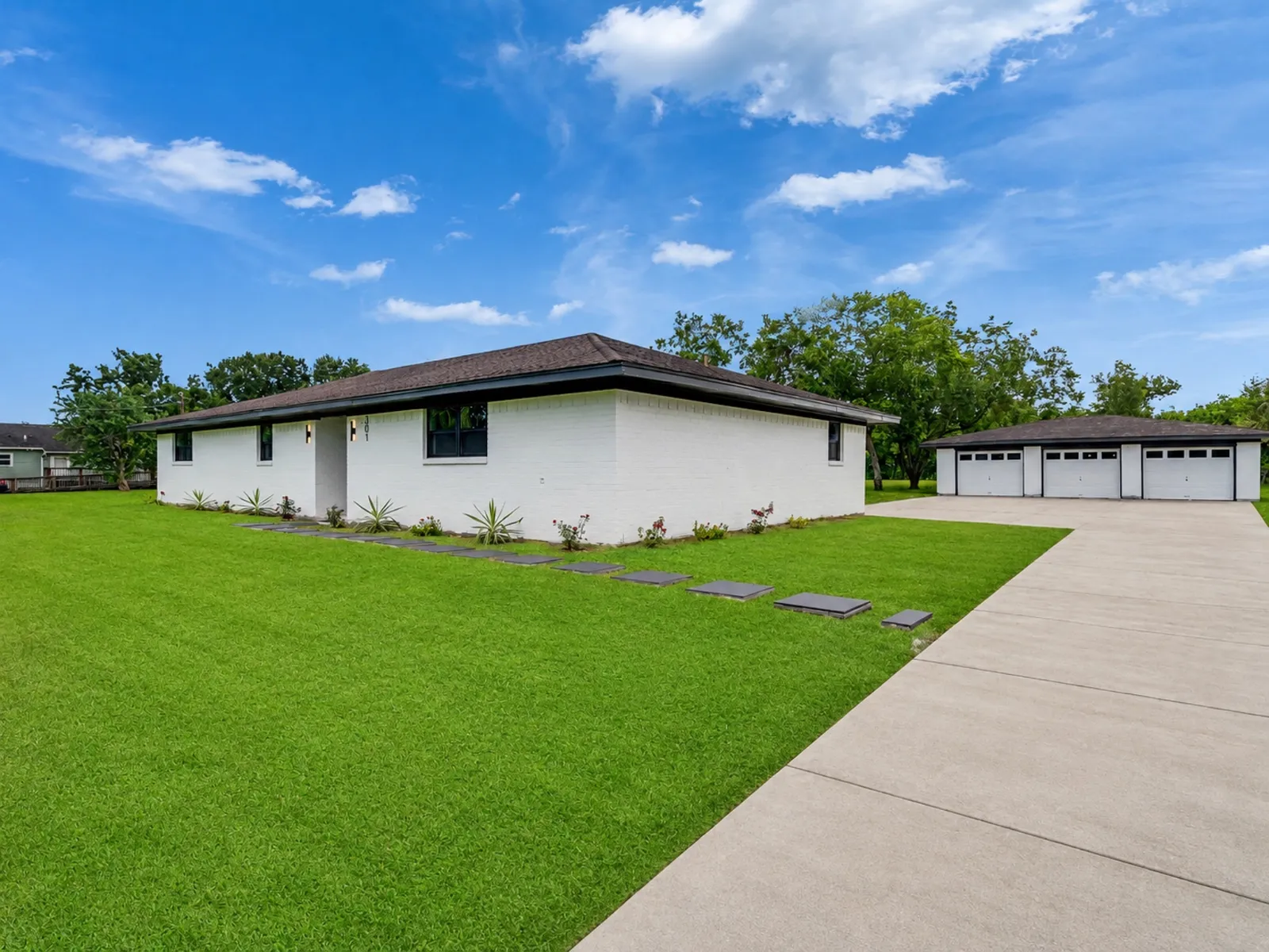 New driveway and planting after a whole home renovation in The Woodlands, TX